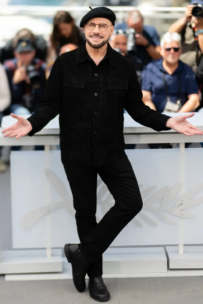 John Travolta Cannes 2026 Beret Look — The Viral Fashion Moment With the Most Heartwarming Story Behind It John Travolta navy beret Cannes 1