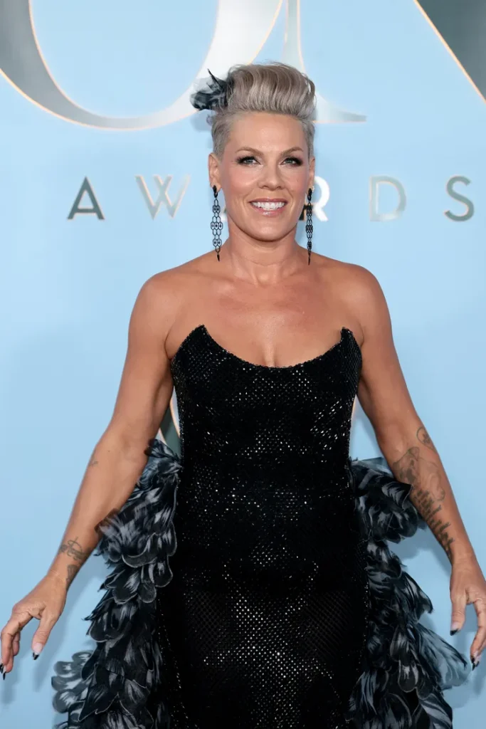 Tony Awards 2026 Best Dressed — Pink's Host Looks, Danielle Brooks, and Every Red Carpet Moment Pink strapless feathered gown Tony Awards