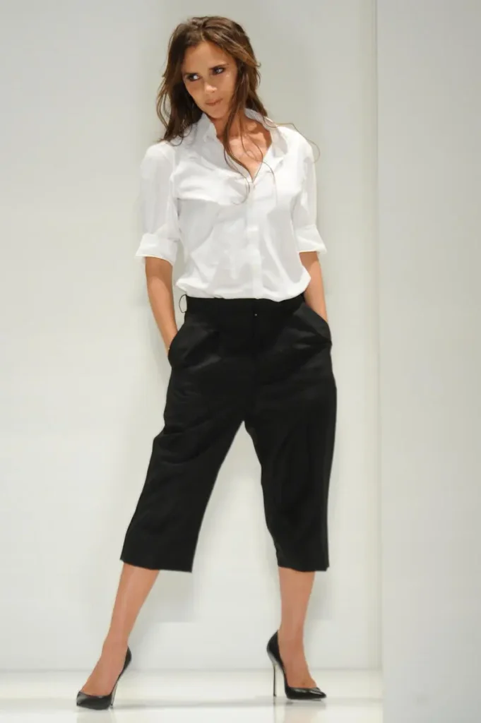 Victoria Beckham Style Evolution — From Spice Girl to Global Fashion Icon Fashion designer Victoria Beckham on the runway after her spring 2014 show at Cafe Rouge.
